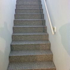 Coated wood stairs to a basement